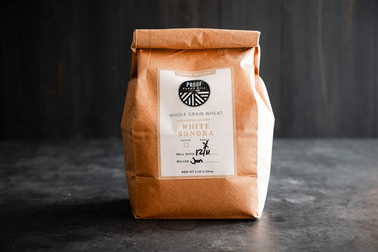 A bag of Arizona-grown White Sonora heritage wheat flour stone-milled by Proof Flour Mill.